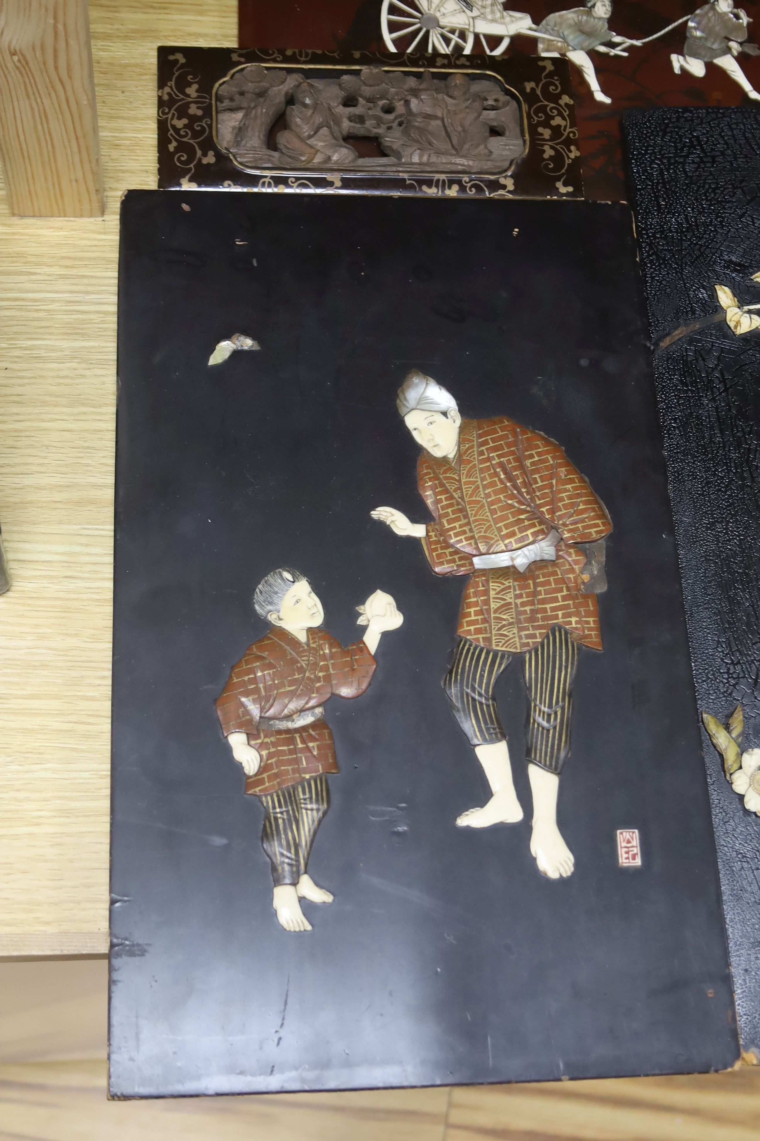 Five 19th century Japanese lacquer and bone panels, largest 45 x 30cm